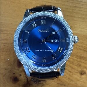 Men’s blue Stauer wrist watch, date, 3atm water resistant, leather band